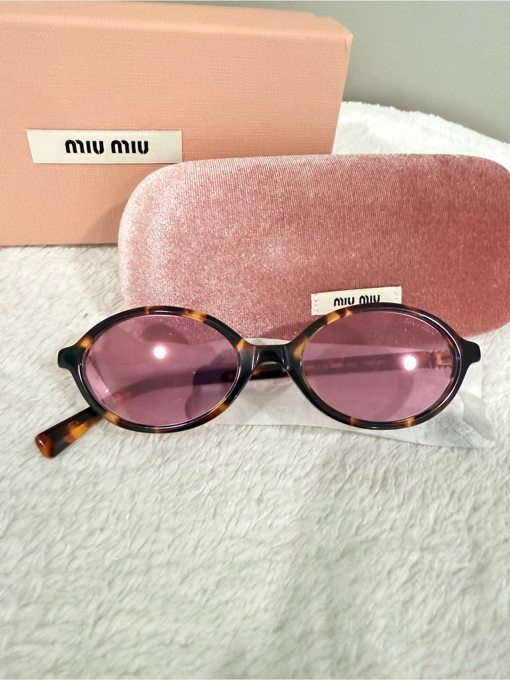 Miu Miu Tortoiseshell Oval Sunglasses with Pink Lenses